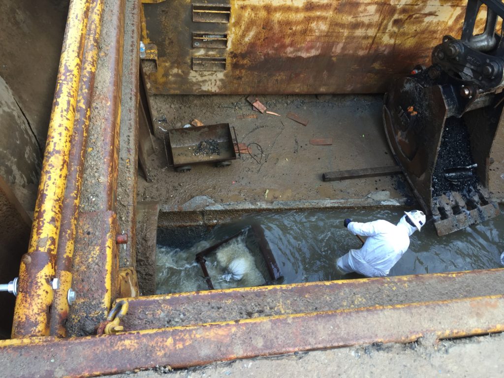 This was an open trench and they were manually digging the grit from the trough